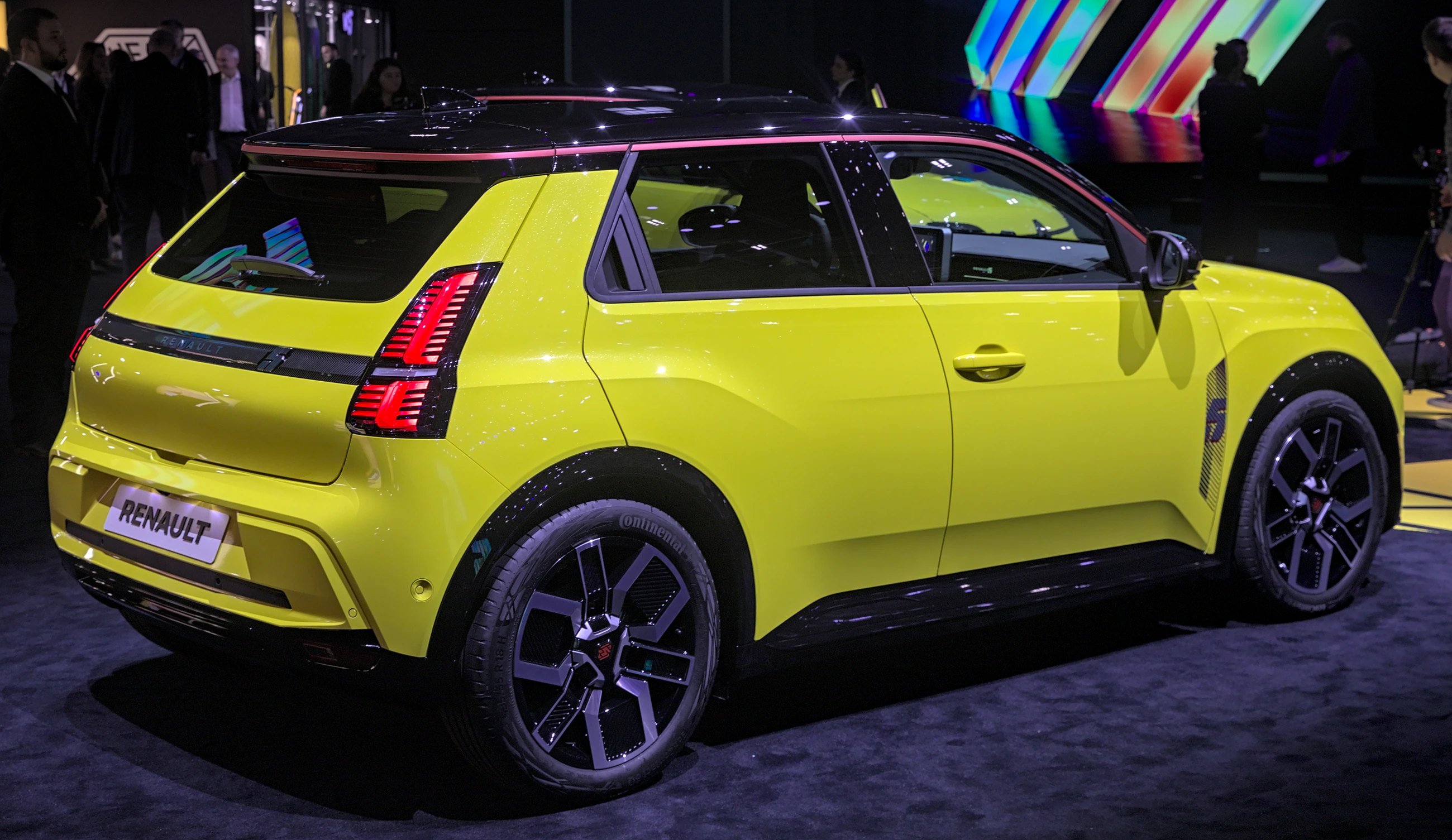 Yellow Renault 5 E-Tech electric from the rear three-quarter angle